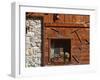 A Rich Wooden Wall with Rustic Tools and Window and a Stone Wall-null-Framed Photographic Print