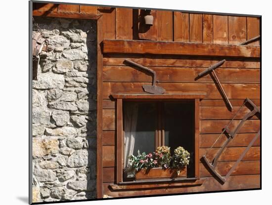 A Rich Wooden Wall with Rustic Tools and Window and a Stone Wall-null-Mounted Photographic Print