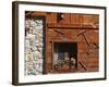 A Rich Wooden Wall with Rustic Tools and Window and a Stone Wall-null-Framed Photographic Print