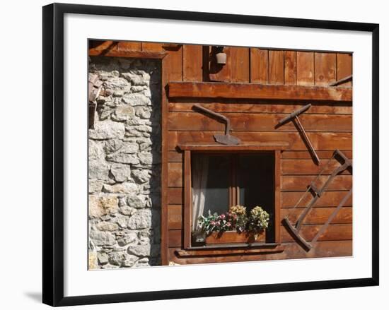 A Rich Wooden Wall with Rustic Tools and Window and a Stone Wall-null-Framed Photographic Print