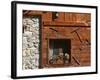 A Rich Wooden Wall with Rustic Tools and Window and a Stone Wall-null-Framed Photographic Print