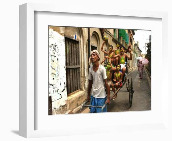 A Rickshaw Puller Carries Supporters of Brazil Soccer Team-null-Framed Photographic Print