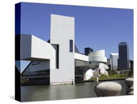 A Ring-Billed Gull Takes Flight in Front of the Rock and Roll Hall of Fame and Museum-null-Stretched Canvas