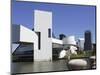 A Ring-Billed Gull Takes Flight in Front of the Rock and Roll Hall of Fame and Museum-null-Mounted Photographic Print
