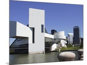 A Ring-Billed Gull Takes Flight in Front of the Rock and Roll Hall of Fame and Museum-null-Mounted Photographic Print
