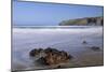 A Rising Tide Swirls around a Rock on the Beach at Trebarwith Strand-Nick Upton-Mounted Photographic Print