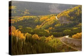 A Road Meanders Through the Brilliant Fall Colors of the San Juan Mountains of Colorado-John Alves-Stretched Canvas