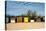 A Row of Beach Changing Huts-Will Wilkinson-Stretched Canvas