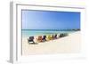 A Row of Colourful Wooden Deckchairs on Palm Beach, Aruba, Netherlands Antilles-Jane Sweeney-Framed Photographic Print