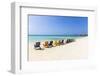 A Row of Colourful Wooden Deckchairs on Palm Beach, Aruba, Netherlands Antilles-Jane Sweeney-Framed Photographic Print