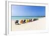 A Row of Colourful Wooden Deckchairs on Palm Beach, Aruba, Netherlands Antilles-Jane Sweeney-Framed Photographic Print