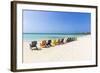 A Row of Colourful Wooden Deckchairs on Palm Beach, Aruba, Netherlands Antilles-Jane Sweeney-Framed Photographic Print
