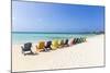 A Row of Colourful Wooden Deckchairs on Palm Beach, Aruba, Netherlands Antilles-Jane Sweeney-Mounted Photographic Print