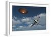 A Royal Air Force Supermarine Spitfire Aircraft Giving Chase to a Ufo-null-Framed Art Print