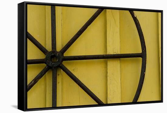 A Rusty Wheel from a Deck Is Nailed to an Outdoor Wall in Key West, Florida-Sergio Ballivian-Framed Stretched Canvas