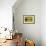 A Rusty Wheel from a Deck Is Nailed to an Outdoor Wall in Key West, Florida-Sergio Ballivian-Framed Photographic Print displayed on a wall