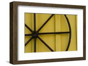 A Rusty Wheel from a Deck Is Nailed to an Outdoor Wall in Key West, Florida-Sergio Ballivian-Framed Photographic Print