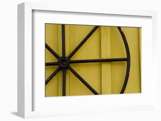 A Rusty Wheel from a Deck Is Nailed to an Outdoor Wall in Key West, Florida-Sergio Ballivian-Framed Photographic Print