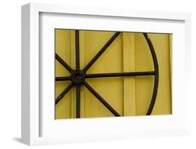 A Rusty Wheel from a Deck Is Nailed to an Outdoor Wall in Key West, Florida-Sergio Ballivian-Framed Photographic Print