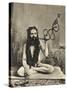 A Sadhu Smoking a Remarkable Pipe, India-null-Stretched Canvas