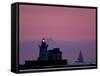 A Sailboat Slips Past a Lighthouse as the Sunset Comes to Lake Erie off the Coast of Cleveland-null-Framed Stretched Canvas