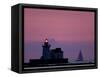 A Sailboat Slips Past a Lighthouse as the Sunset Comes to Lake Erie off the Coast of Cleveland-null-Framed Stretched Canvas