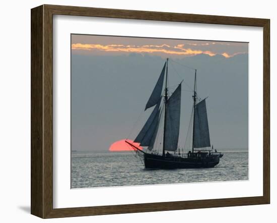 A Sailing Ship Sails During Sunset Towards the Harbor of Bremerhaven-null-Framed Premium Photographic Print