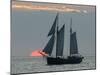 A Sailing Ship Sails During Sunset Towards the Harbor of Bremerhaven-null-Mounted Premium Photographic Print