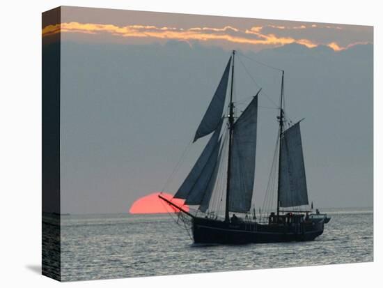 A Sailing Ship Sails During Sunset Towards the Harbor of Bremerhaven-null-Stretched Canvas