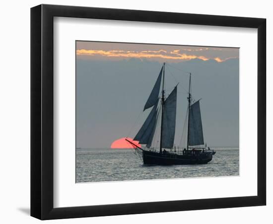 A Sailing Ship Sails During Sunset Towards the Harbor of Bremerhaven-null-Framed Photographic Print