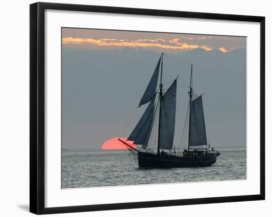 A Sailing Ship Sails During Sunset Towards the Harbor of Bremerhaven-null-Framed Photographic Print