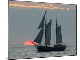 A Sailing Ship Sails During Sunset Towards the Harbor of Bremerhaven-null-Mounted Photographic Print