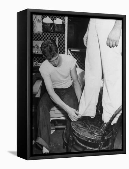 A Sailor in the Tailor Shop Aboard a US Navy Cruiser Checking Uniform Trousers of Another Sailor-null-Framed Stretched Canvas