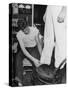 A Sailor in the Tailor Shop Aboard a US Navy Cruiser Checking Uniform Trousers of Another Sailor-null-Stretched Canvas