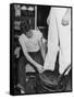 A Sailor in the Tailor Shop Aboard a US Navy Cruiser Checking Uniform Trousers of Another Sailor-null-Framed Stretched Canvas