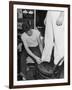 A Sailor in the Tailor Shop Aboard a US Navy Cruiser Checking Uniform Trousers of Another Sailor-null-Framed Photographic Print