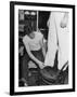 A Sailor in the Tailor Shop Aboard a US Navy Cruiser Checking Uniform Trousers of Another Sailor-null-Framed Photographic Print