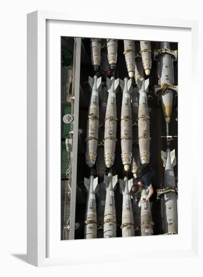 A Sailor Maintains and Cleans Ordnance Aboard USS Nimitz-null-Framed Photographic Print