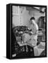 A Sailor Pressing Uniform Trousers in the Tailor Shop of a US Navy Cruiser-null-Framed Stretched Canvas