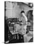 A Sailor Pressing Uniform Trousers in the Tailor Shop of a US Navy Cruiser-null-Stretched Canvas