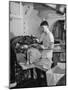 A Sailor Pressing Uniform Trousers in the Tailor Shop of a US Navy Cruiser-null-Mounted Photographic Print