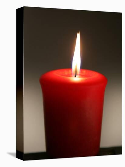 A Scented Votive Candle Burns-null-Stretched Canvas