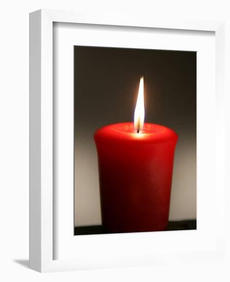 A Scented Votive Candle Burns-null-Framed Photographic Print