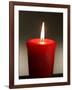 A Scented Votive Candle Burns-null-Framed Photographic Print