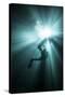 A Scuba Diver Ascends into the Light Emanating Above-null-Stretched Canvas