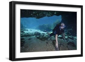 A Scuba Diver Explores the Blue Springs Cave in Marianna, Florida-null-Framed Art Print