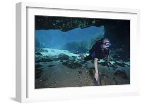 A Scuba Diver Explores the Blue Springs Cave in Marianna, Florida-null-Framed Art Print