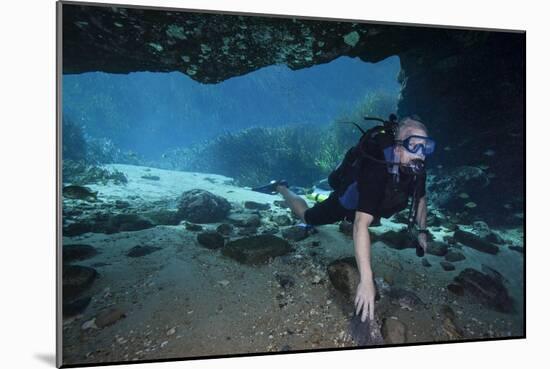 A Scuba Diver Explores the Blue Springs Cave in Marianna, Florida-null-Mounted Art Print