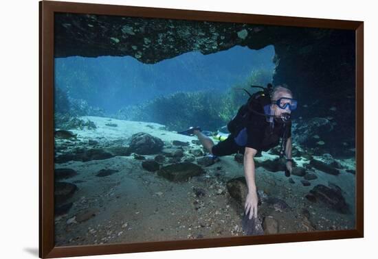 A Scuba Diver Explores the Blue Springs Cave in Marianna, Florida-null-Framed Art Print