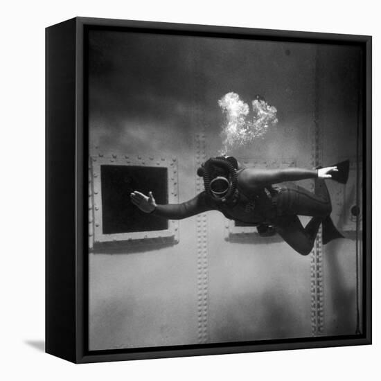 A Scuba Diver Inside a Large Metal Water Tank. Photograph by Heinz Zinram-Heinz Zinram-Framed Stretched Canvas